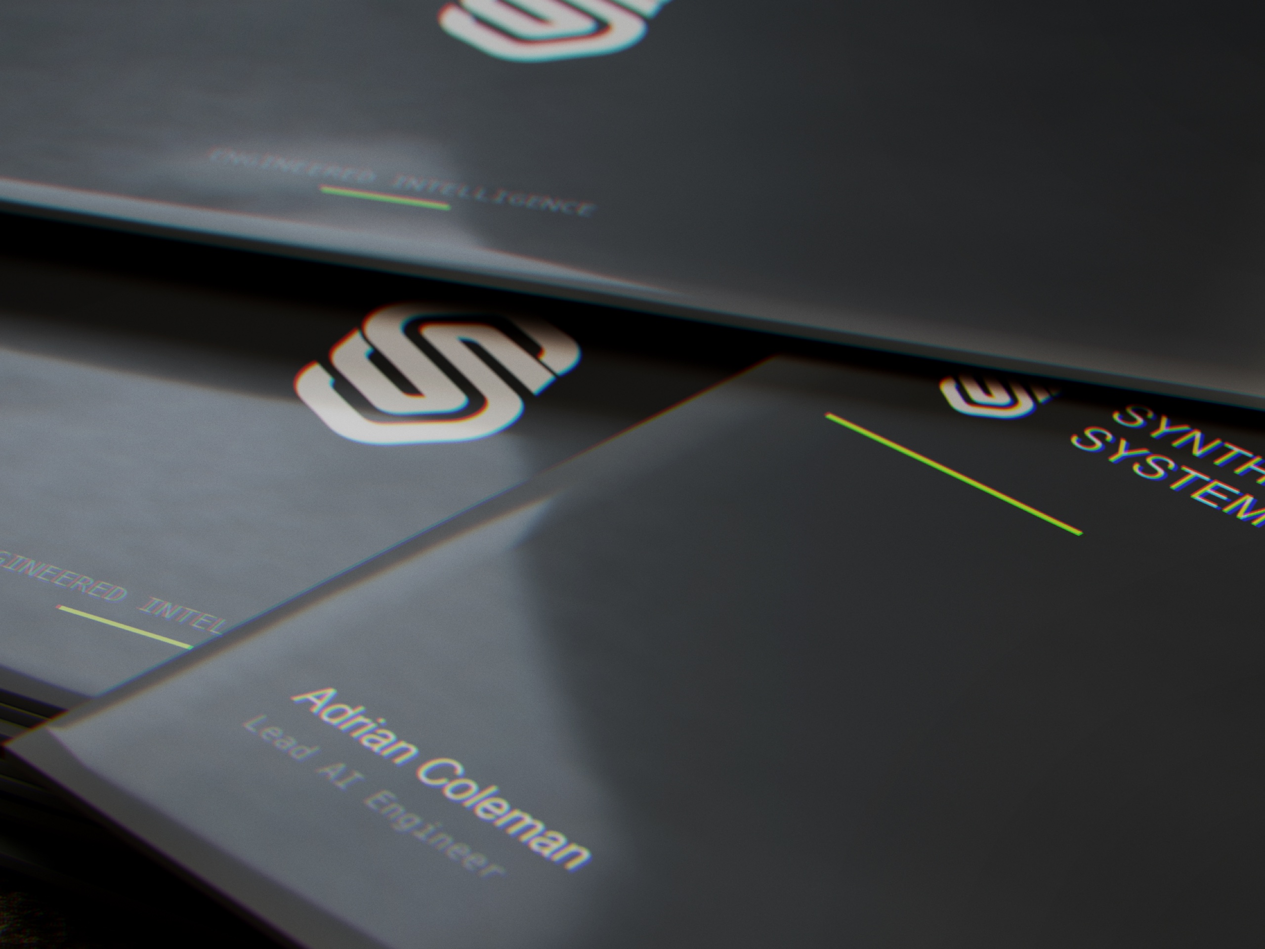 Synthera business cards with the interlaced mark and signal accent line